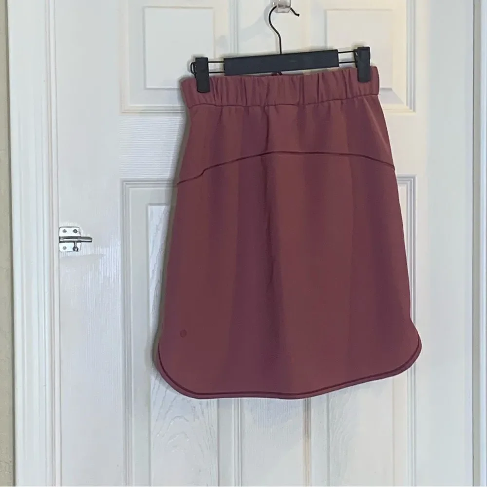Lululemon on the fly skirt, color: cherry cola, size 4